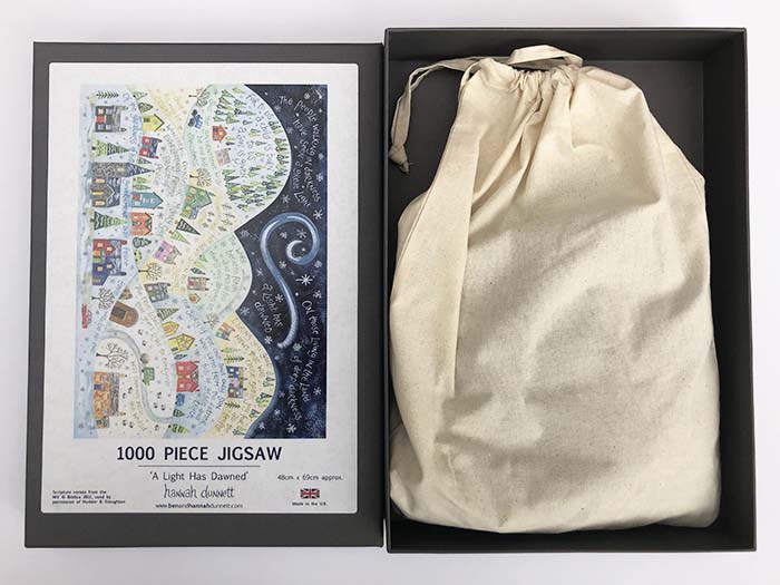 Hannah Dunnett A Light Has Dawned Jigsaw with box and bag
